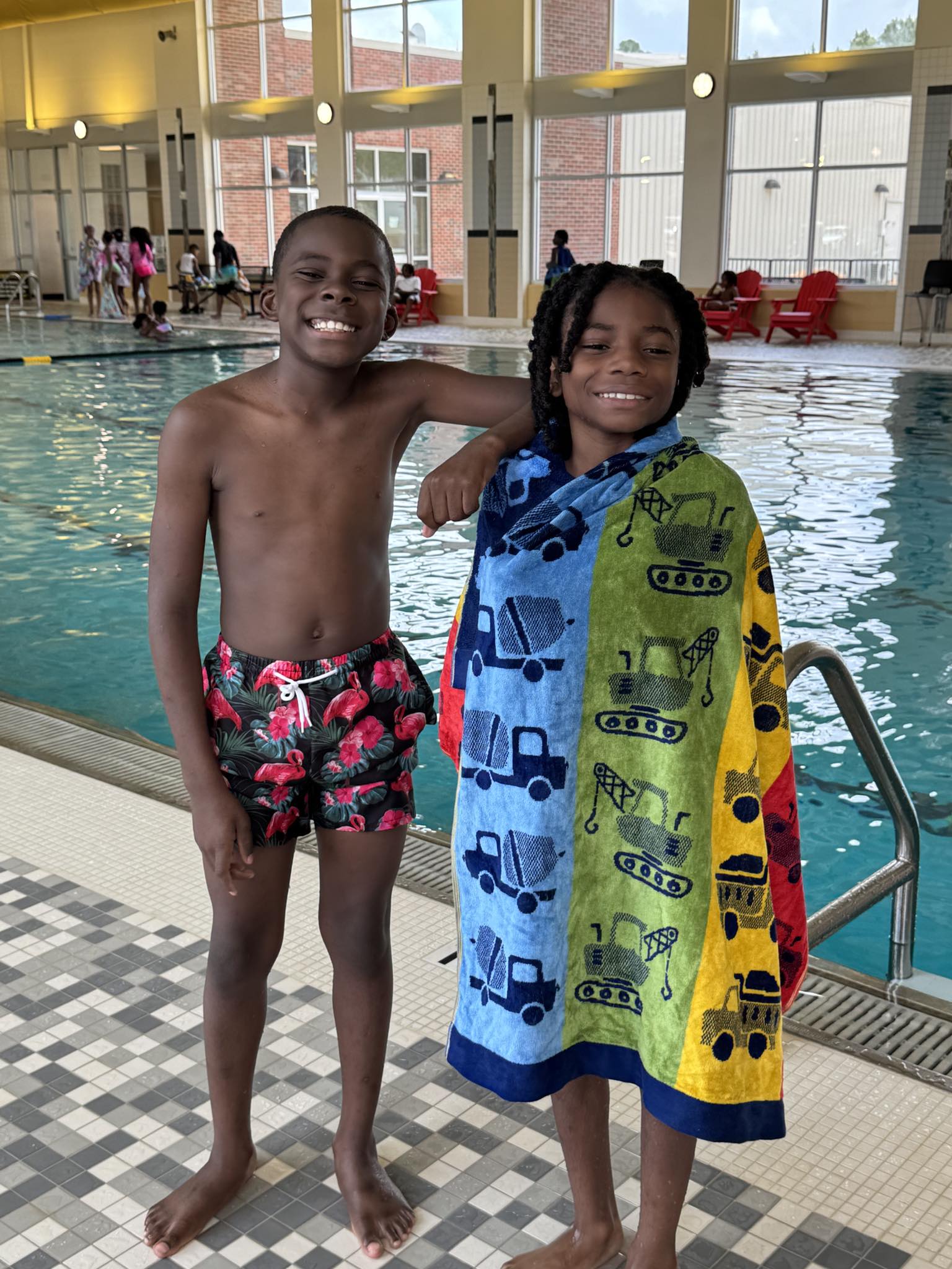 Two boys posing for a picture.